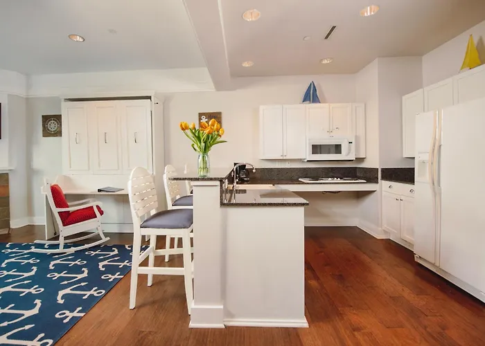 Experience Luxury At Captain Suite 219 In Bay Harbor, Mi, Featuring A Cozy Bedroom And Village View.